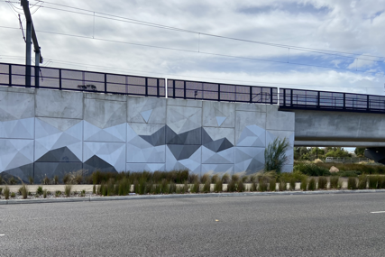 Metallic shades for Frankston’s sparkling rail bridge
