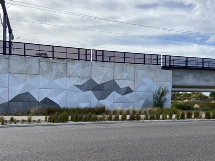 Metallic shades for Frankston’s sparkling rail bridge